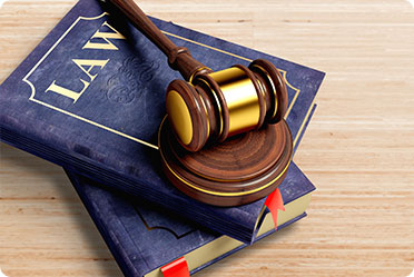 A gavel and two law books - Leckerman Law, LLC