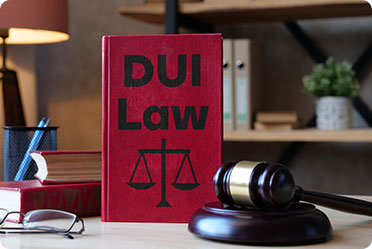 A DUI law book and a gavel - Leckerman Law, LLC