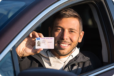 A driver is showing his license - Leckerman Law, LLC