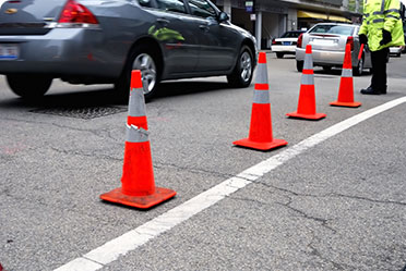 Road barriers and cars on the road - Leckerman Law, LLC