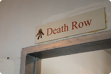 A sign on a wall that says Death Row - Leckerman Law, LLC