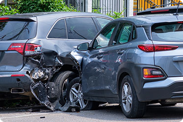 Two damaged cars after a collision - Leckerman Law, LLC