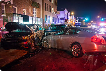 A car accident scene at night - Leckerman Law, LLC