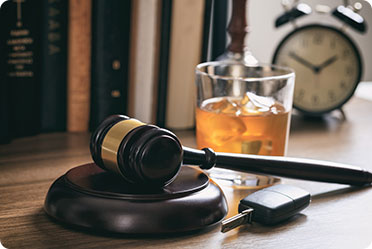 Car keys and a gavel on a desk - Leckerman Law, LLC